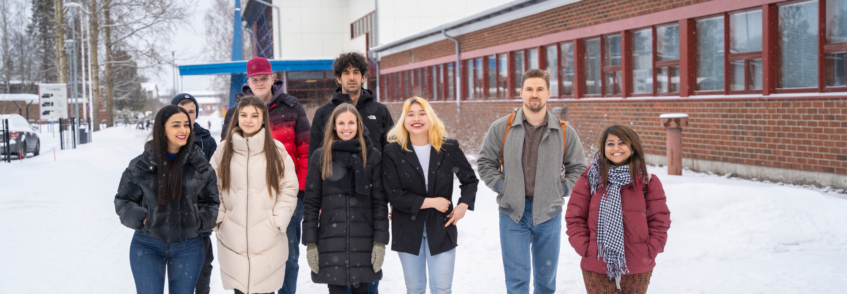 A group of Centria students posing in from of the campus in Kokkola, Finland.