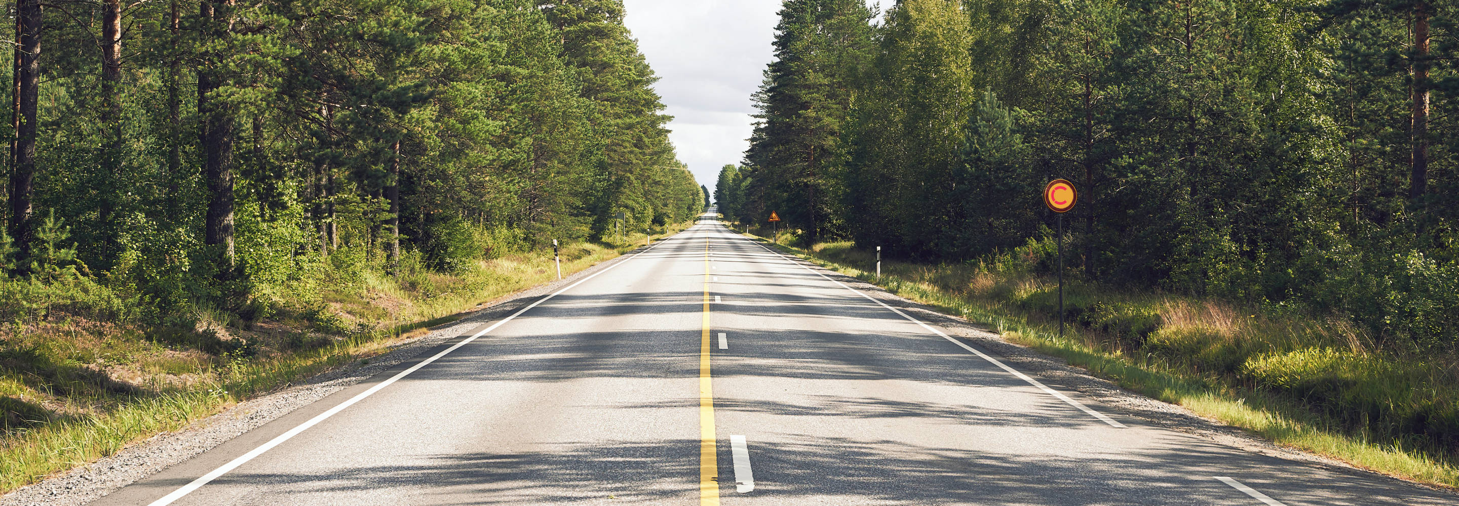Finnish road surrounded by forest