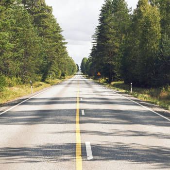 Finnish road surrounded by forest