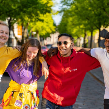 Four students walking and laughing together in Kokkola centre