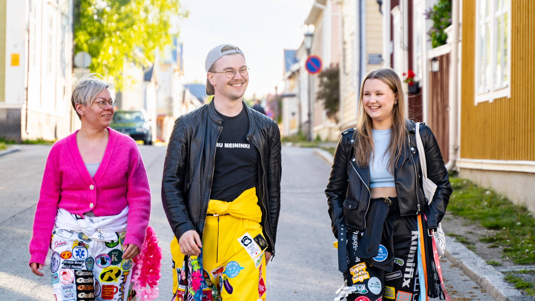 Group of students walking in the old wooden town of Kokkola