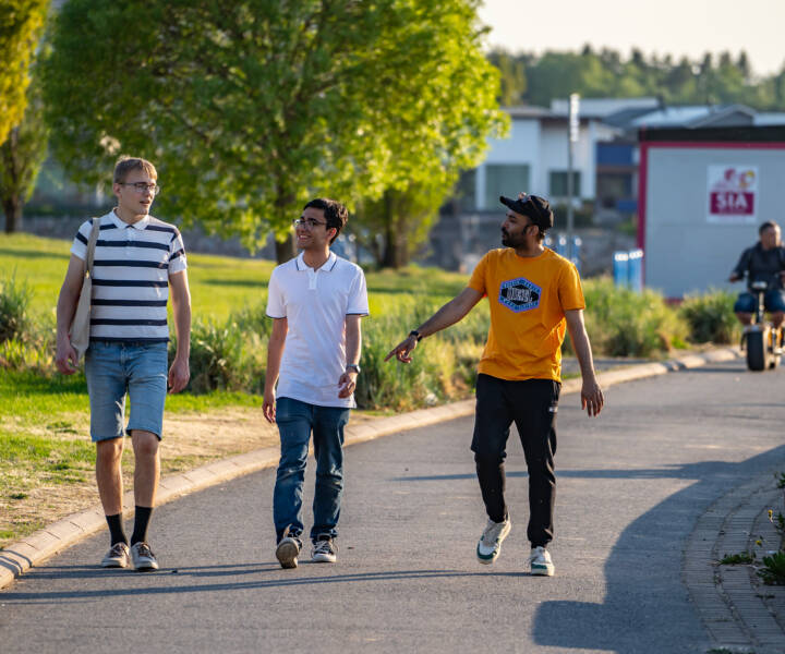 Three students walking in Kokkola during summer