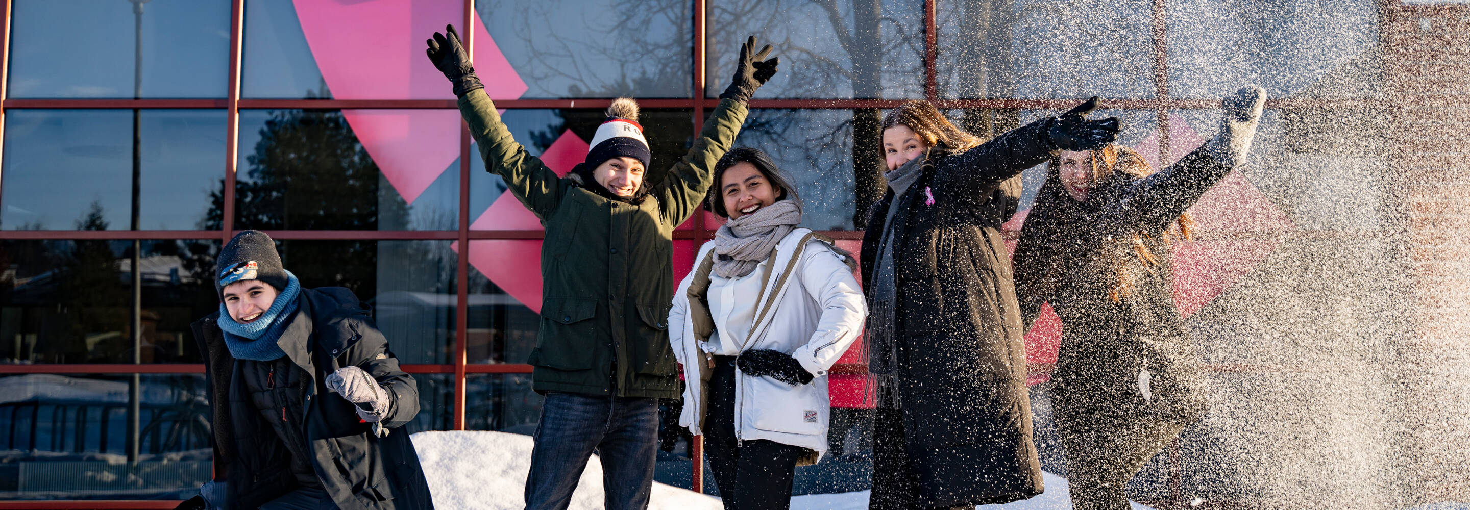 Group of international students pictured in front of Kokkola campus during winter