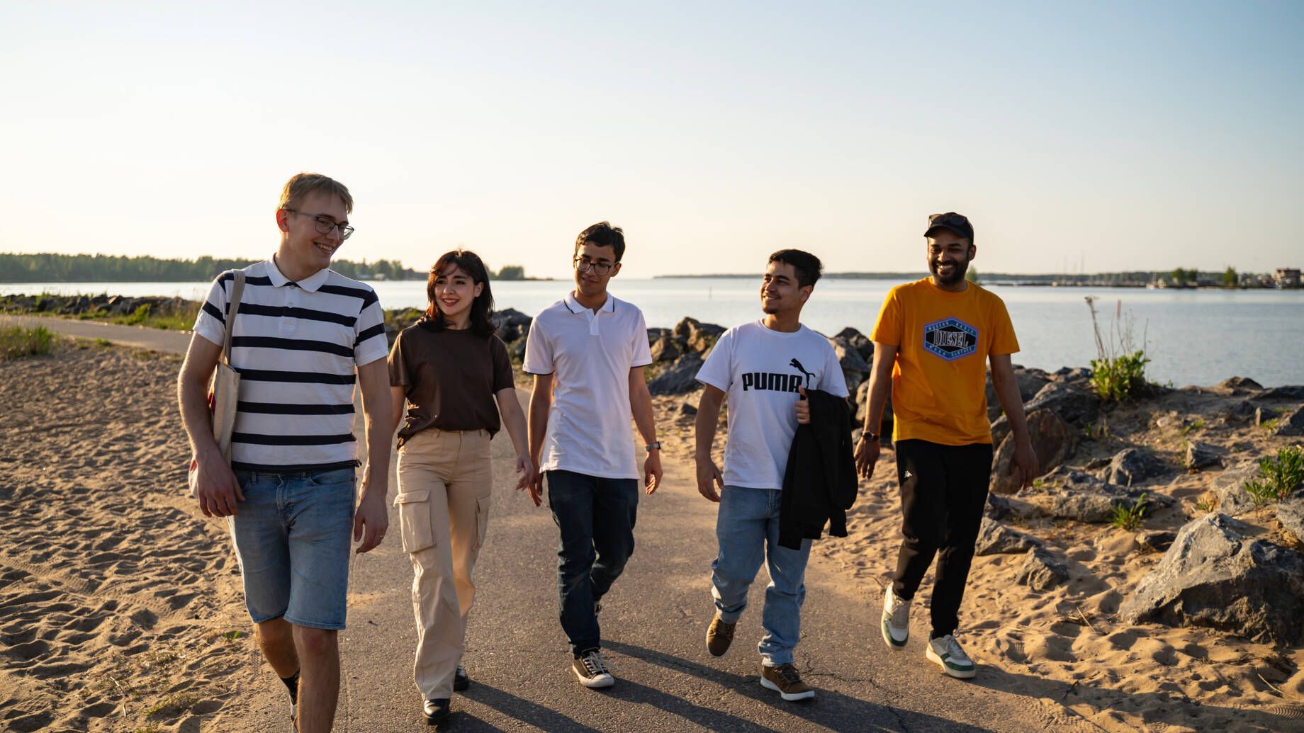 Group of students pictured walking in Kokkola seapark during summer