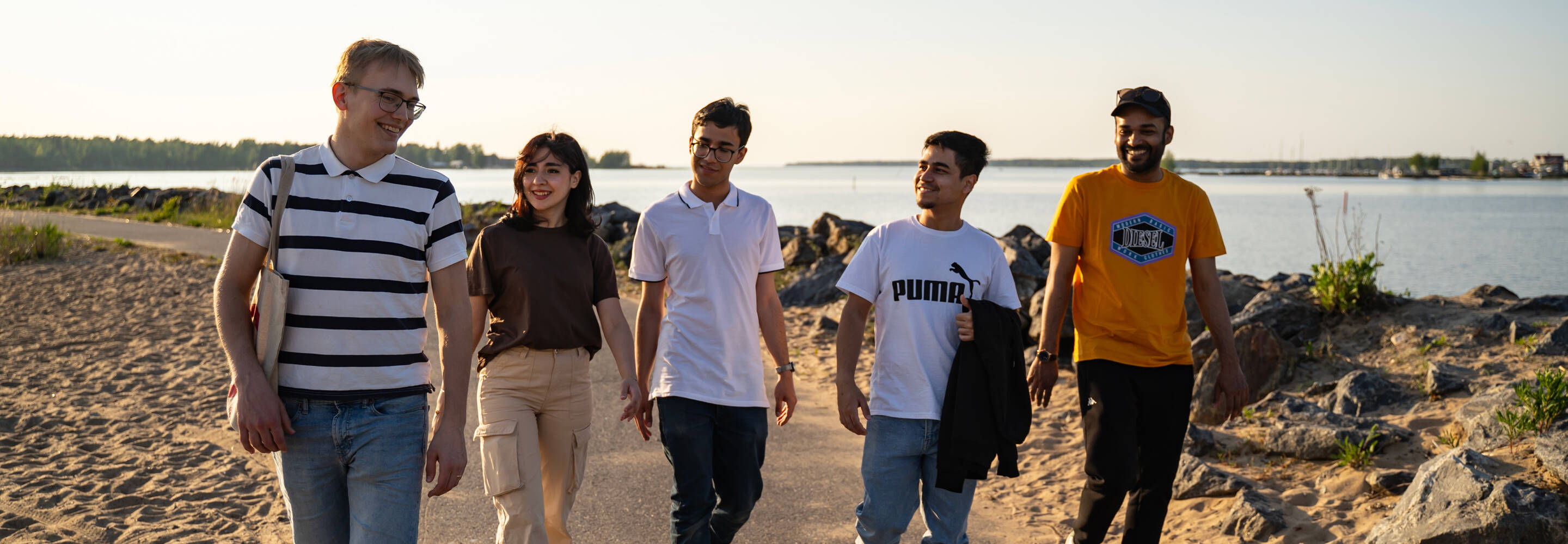 Group of students pictured walking in Kokkola seapark during summer