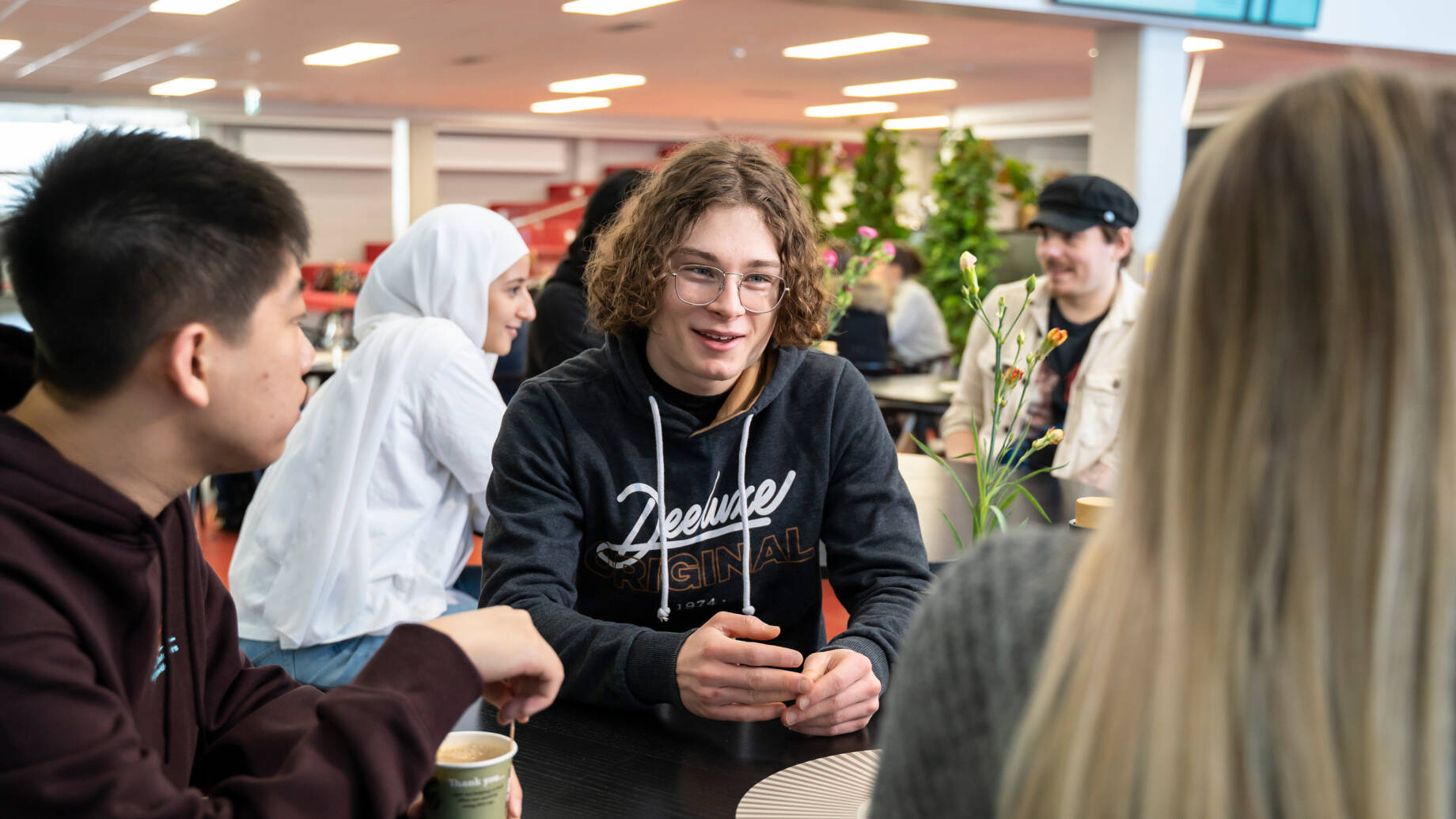 Students sitting together in the cafe of Kokkola campus