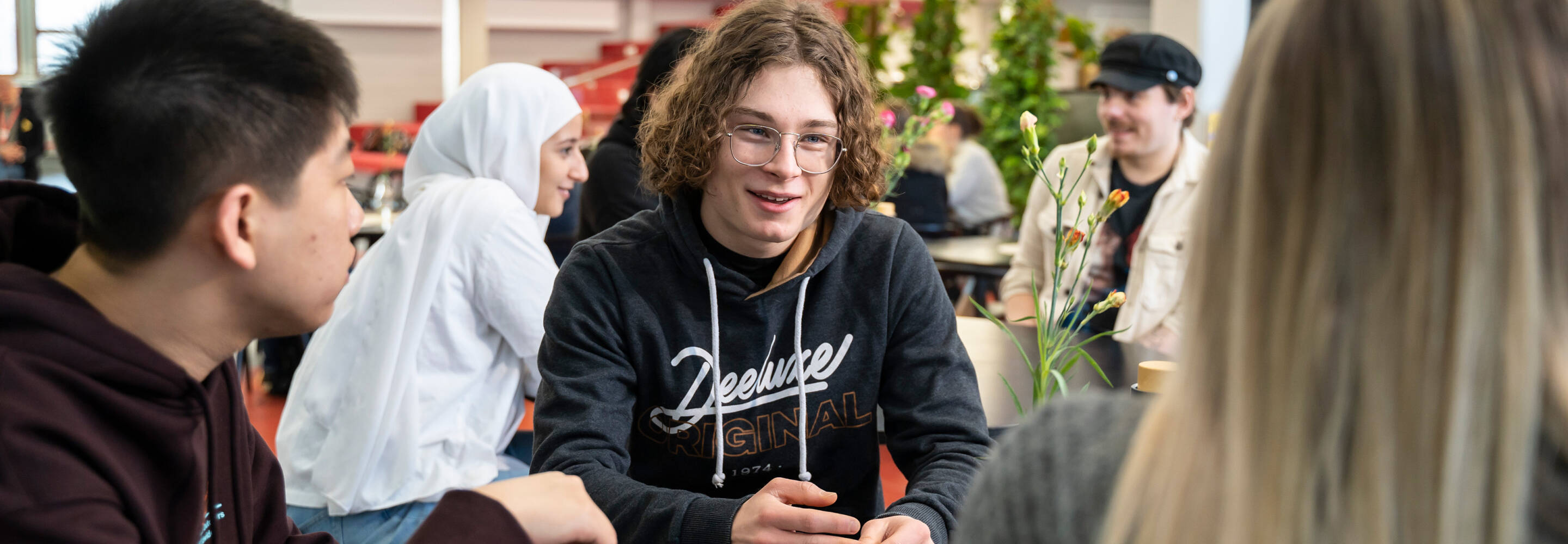 Students sitting together in the cafe of Kokkola campus
