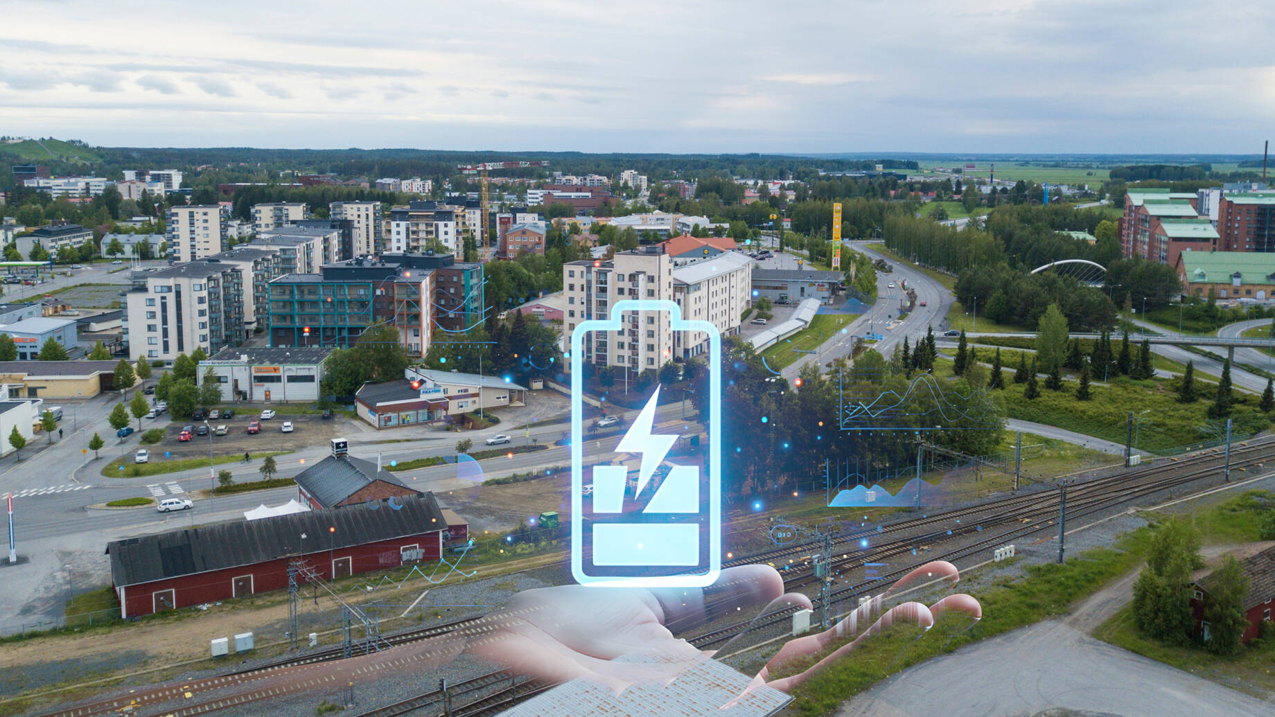 Kuvassa Seinäjoen kaupunki, jonka päällä akku-kuvitusta
